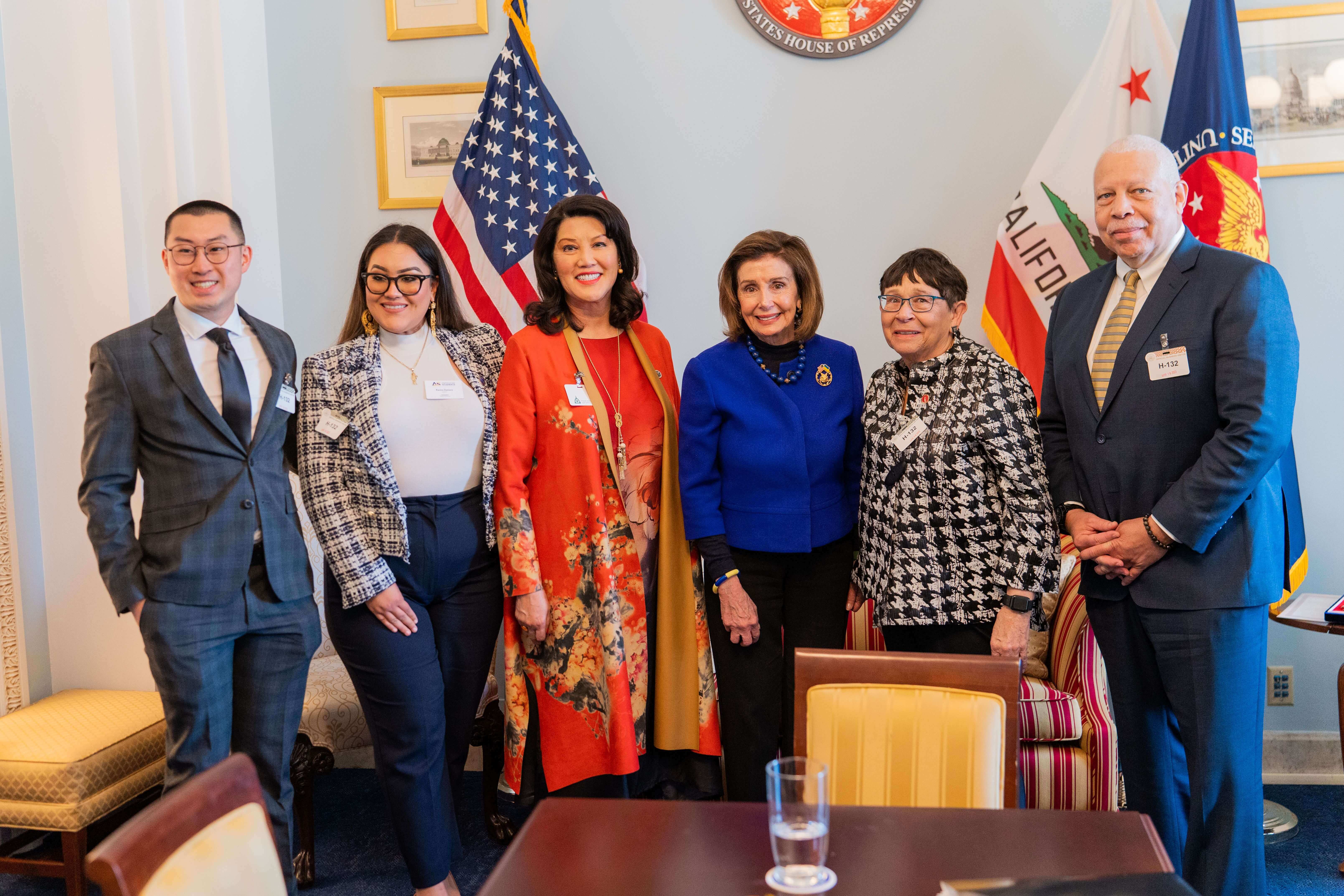 a group of people with nancy pelosi