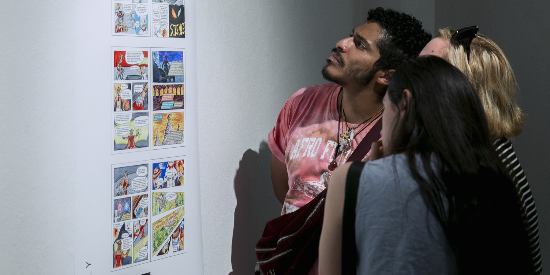 Students walk through art gallery