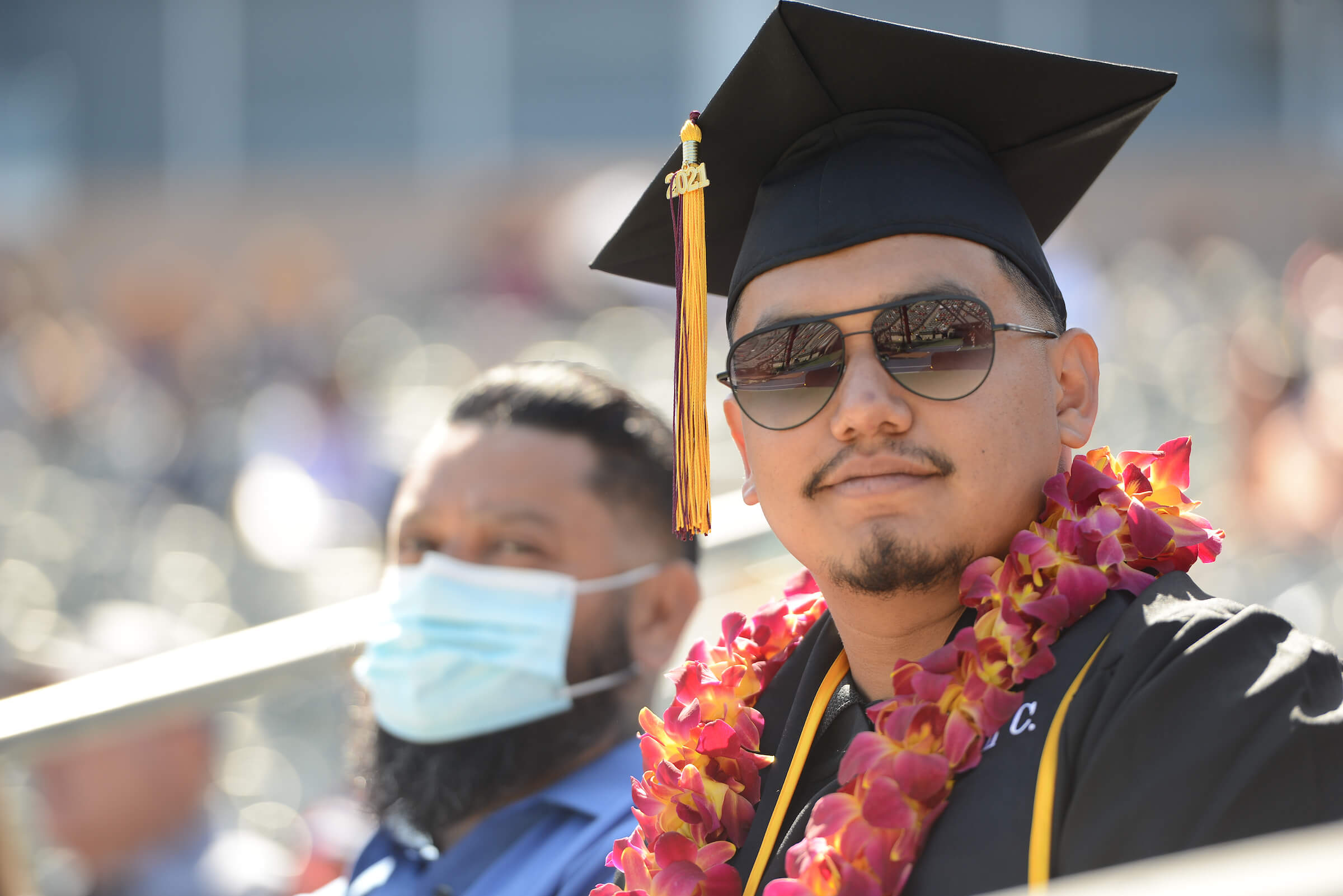 man with grad cap and sunglasses