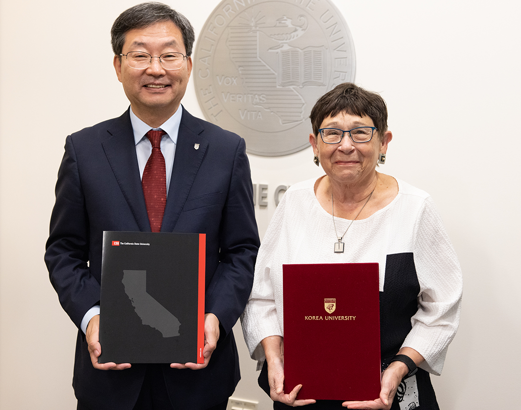 CSU Chancellor Jolene Koester and Korea University President Dr. Jin Taek Chung standing next to each other, smiling