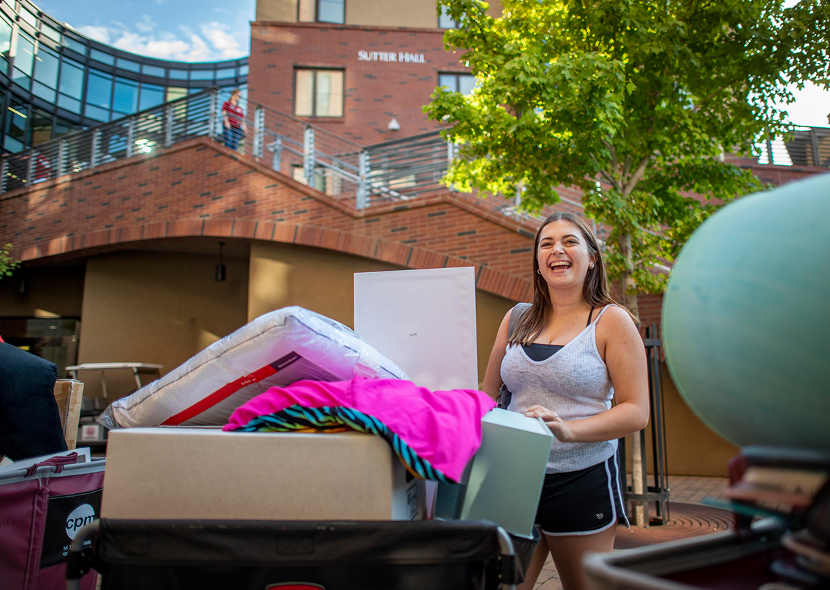 CSU student moving belongings into dorm