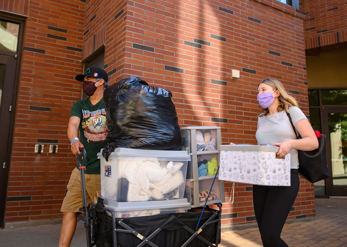 Students moving their belongings into their student housing.