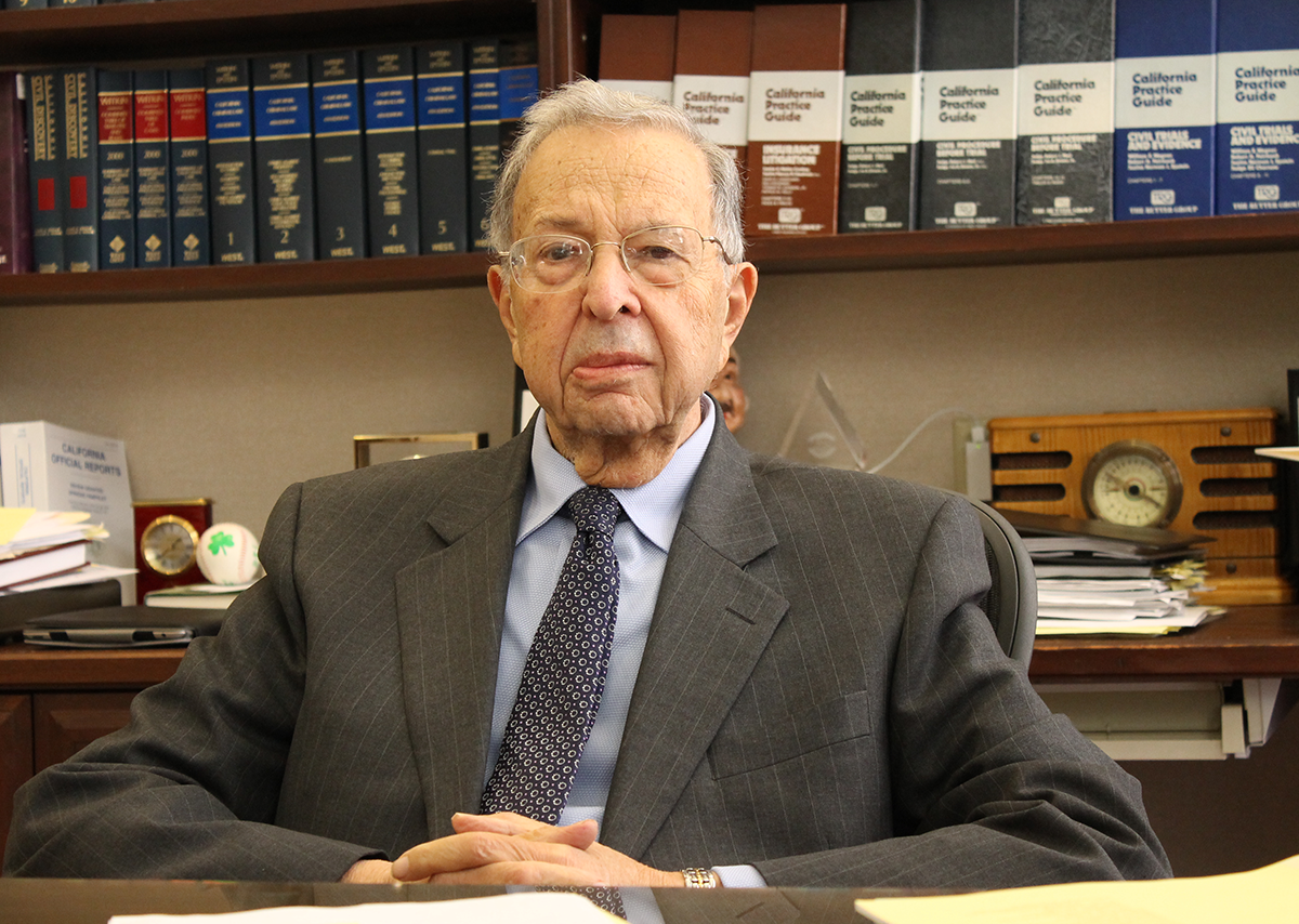 Justice Norman Epstein sitting at his desk