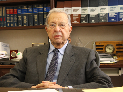 Justice Norman Epstein sitting at his desk