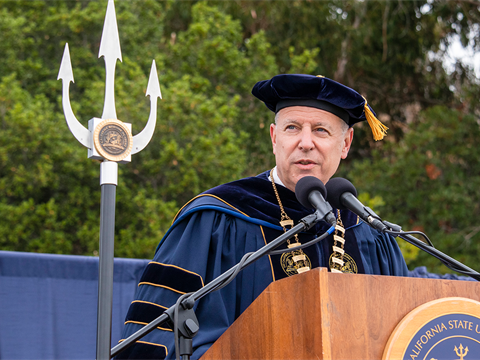 Cal Maritime President Cropper at podium during graduation ceremony