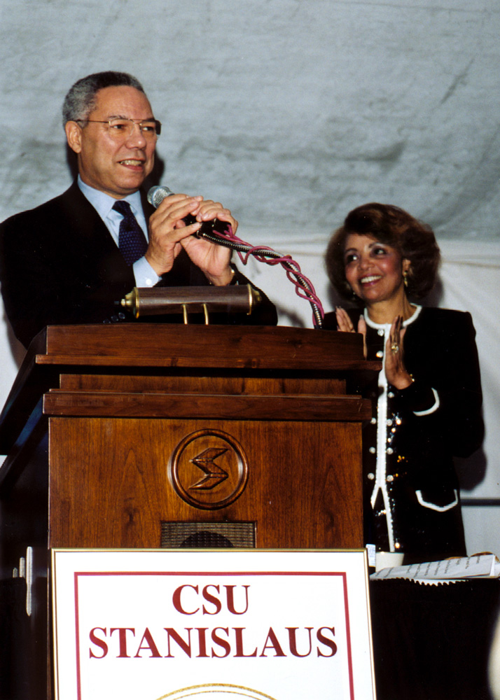 Stanislaus   1998Former Stanislaus State President Marvalene Hughes, Ph.D., applauds while General Colin Powell takes the podium as keynote speaker for the 1998 Stanislaus State Leadership Forum.