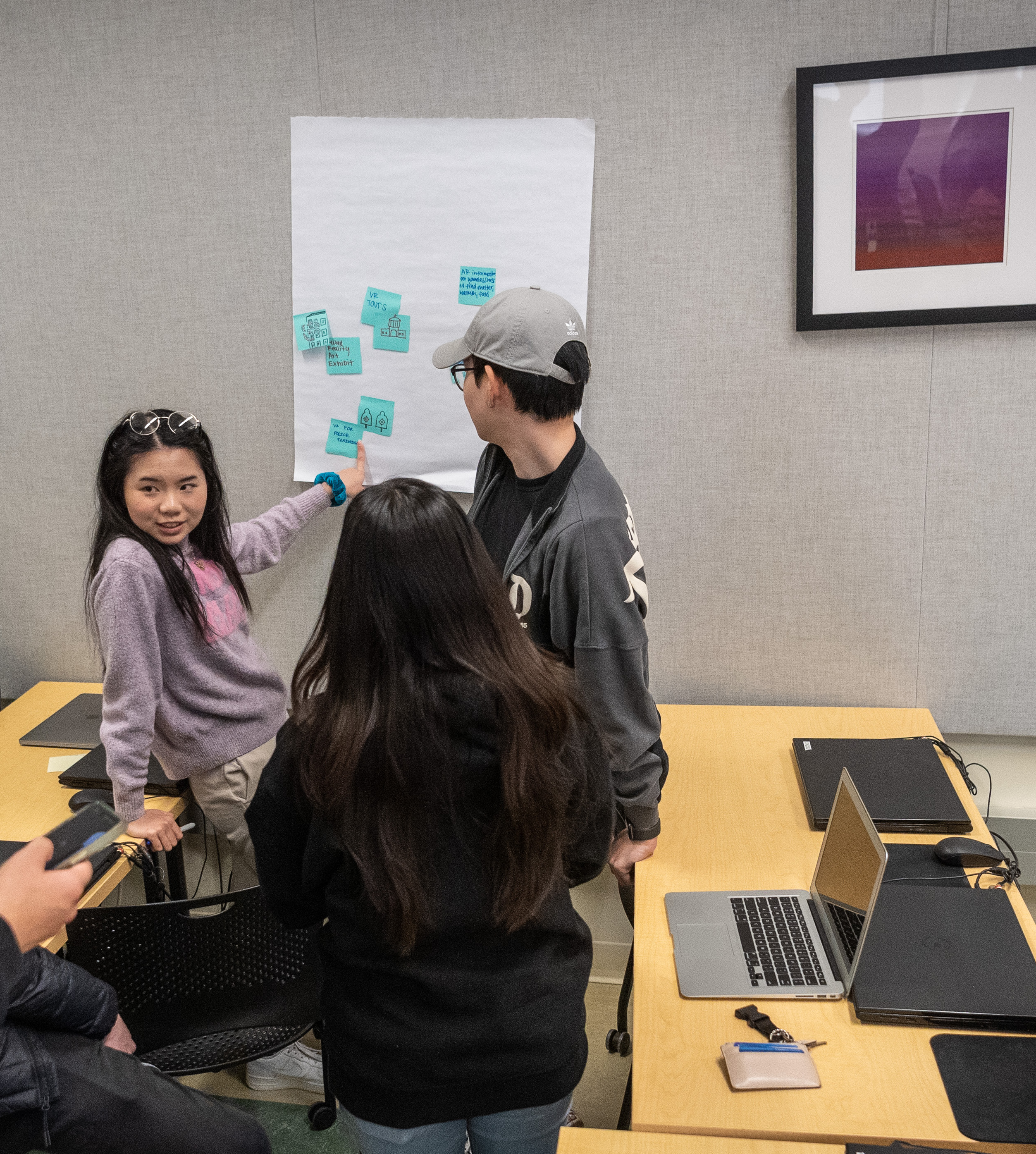 Students work on a developing an AI-powered solution to an issue in their communities.