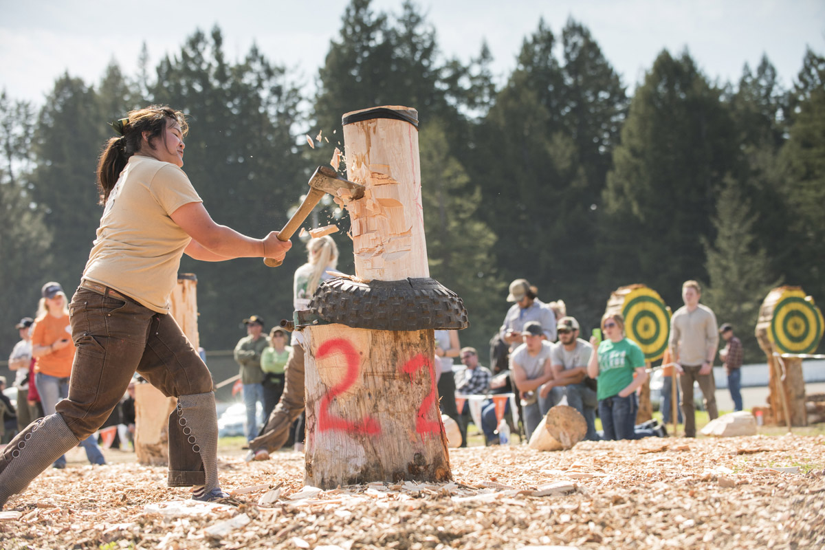 A participant in the Forestry Club Conclave competition in Logging Sports takes a hearty chop. Redwood Acres Fairgrounds, Humboldt County, March 19, 2015.