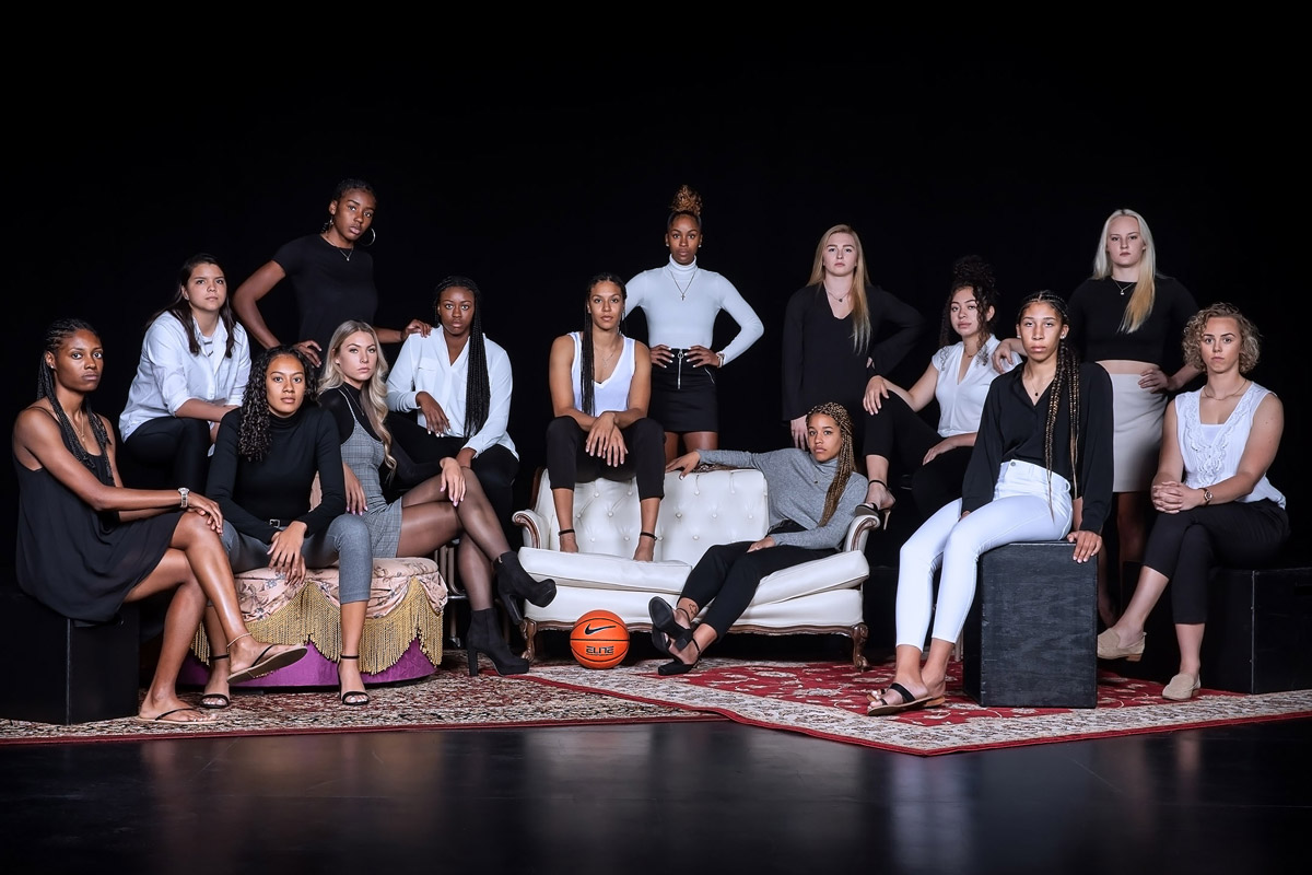 Women's basketball team portrait: From left to right (front row), Maqhi Berry, Kianna Hamilton, Cydnee Kinslow, Aaryon Green (sitting on back of couch), J