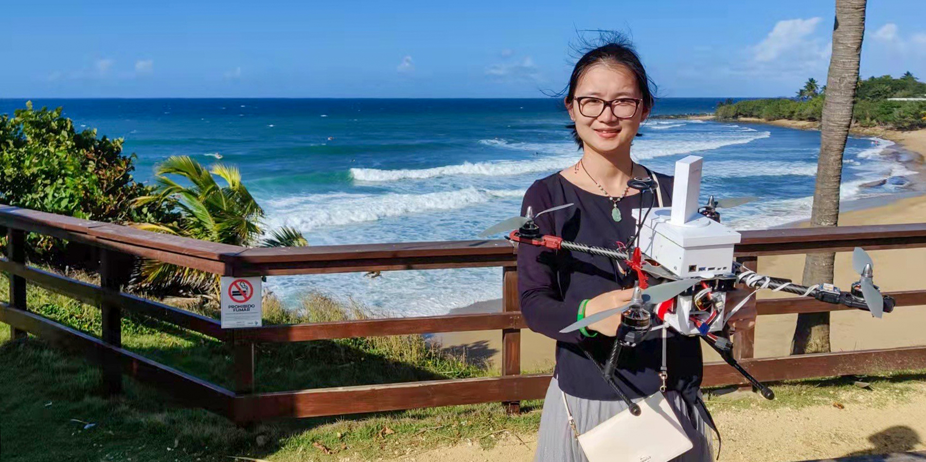 Dr. Junfei Xie holds a drone.