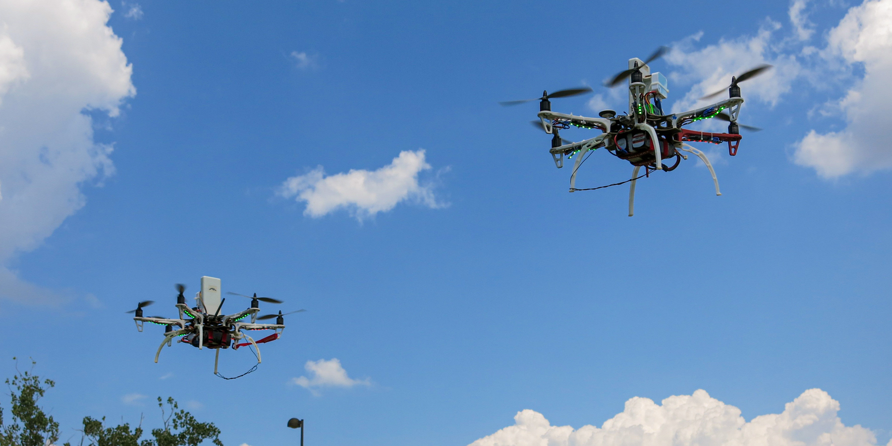 Two drones in flight.