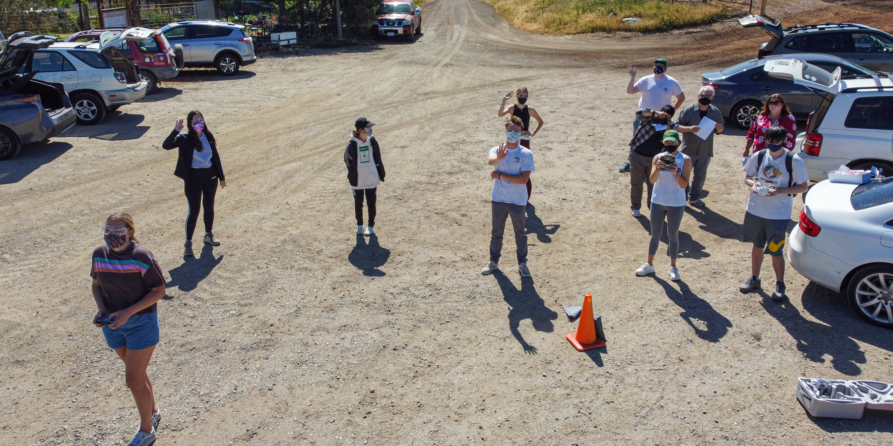 Students get ready for a drone flight to map Cal Poly’s Student Experimental Farm.