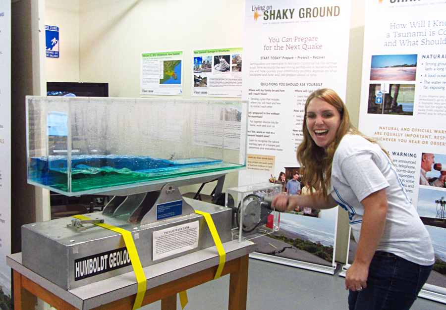 Former geology undergraduate student Katie Bojorquez demonstrates the Earthquake Tsunami Room's tsunami wave tank.