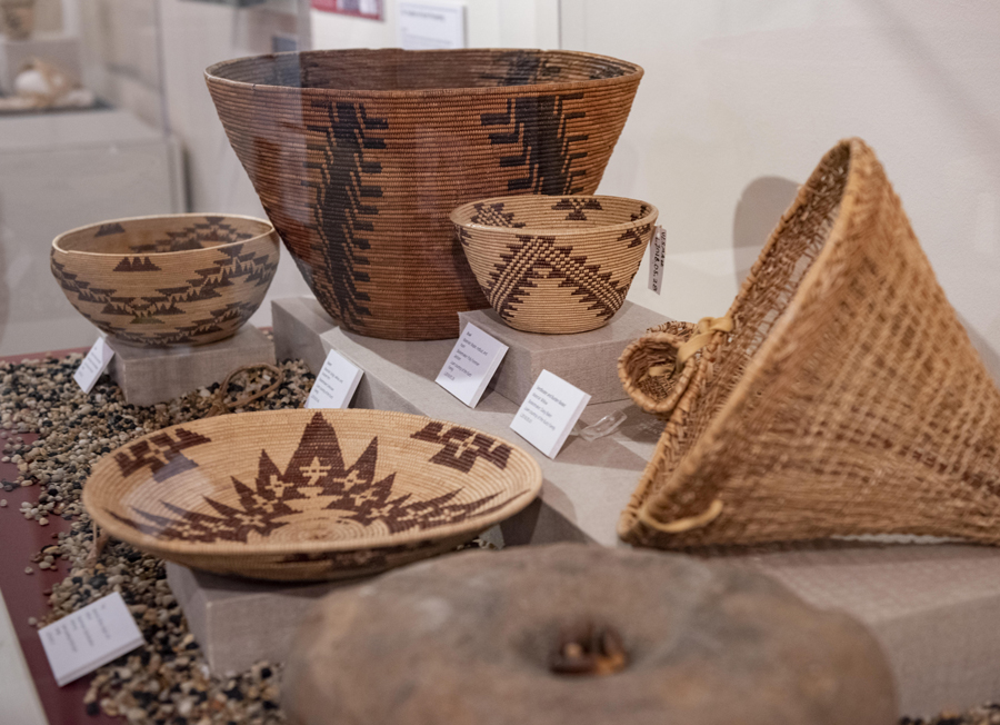A collection of Mountain Maidu baskets crafted by four generations of the Meadows-Baker family, part of the Valene L. Smith Museum of Anthropology’s Unbroken Traditions exhibit.