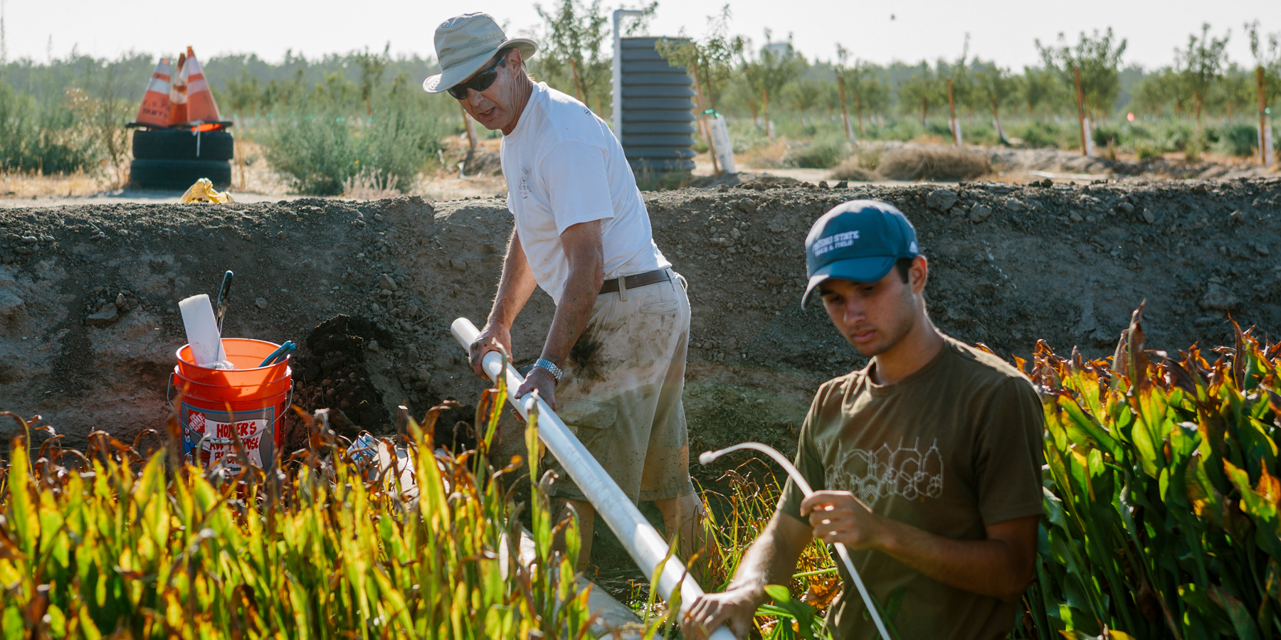 Cordie Qualle, interim director of the California Water Institute, works alongside a Fresno State student on a groundwater refr