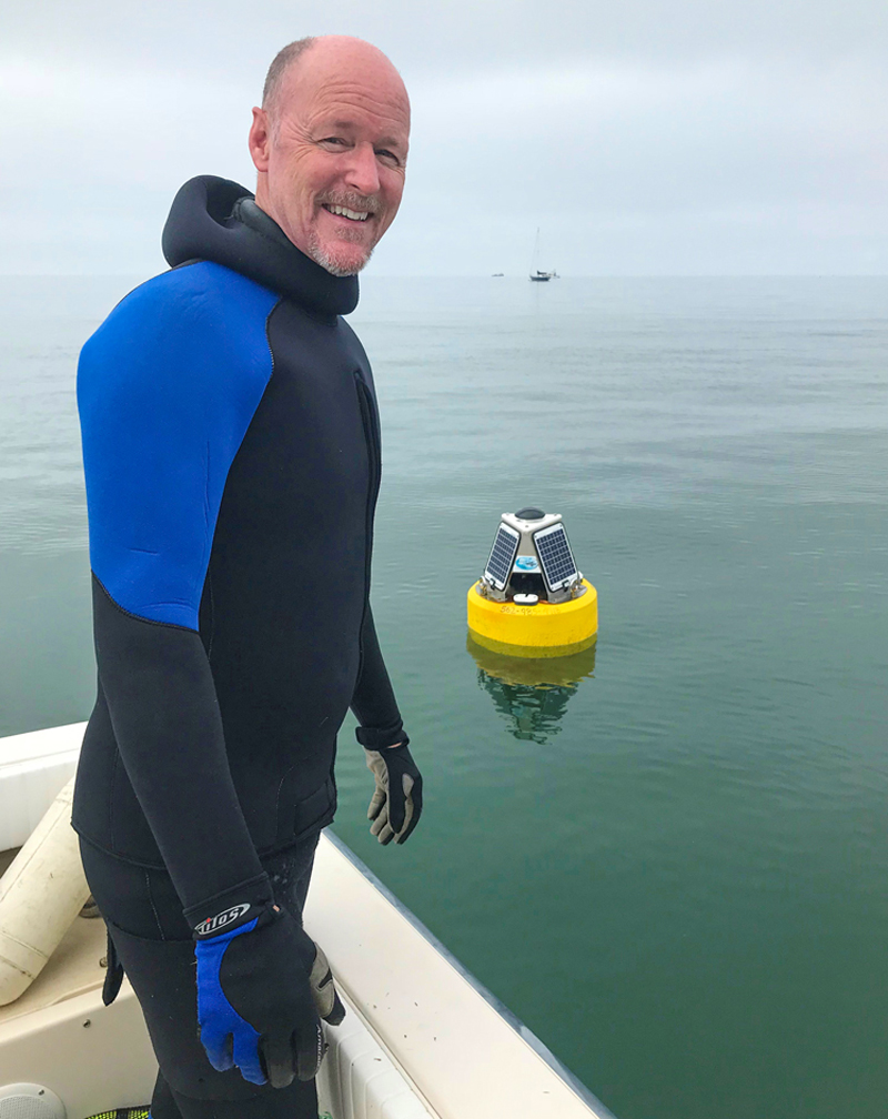 Dr. Chris Lowe pictured with a real-time acoustic receiver buoy prototype. Instead of requiring a diver to retrieve an underwater receiver, this special buoy has a cellular modem and allows for real-time detections of tagged fishes and sharks and can provide text alerts of detections.