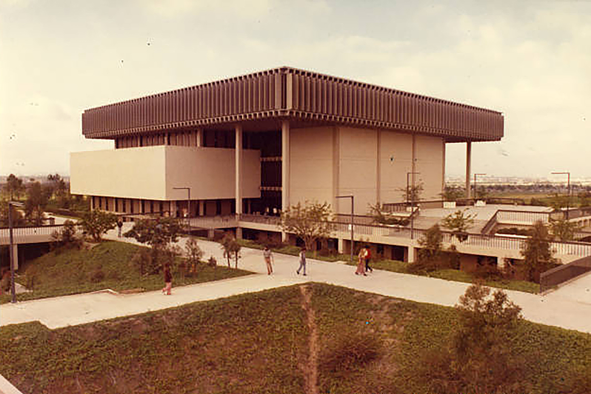 The view of the northeast face of the library, showing the outside assembly area and walkways, 1970s