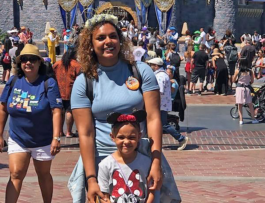 Amilya Franzen and her daughter at a Disney theme park.