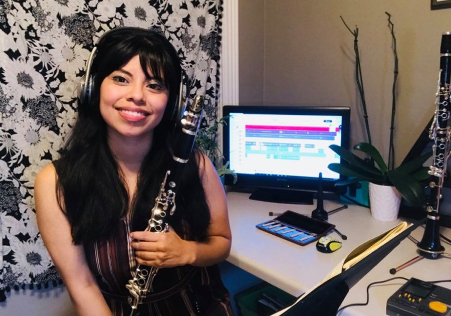 Clarinetist Nancy Cristostomo ​captures her at-home setup where she practices her piece for the animated opera.