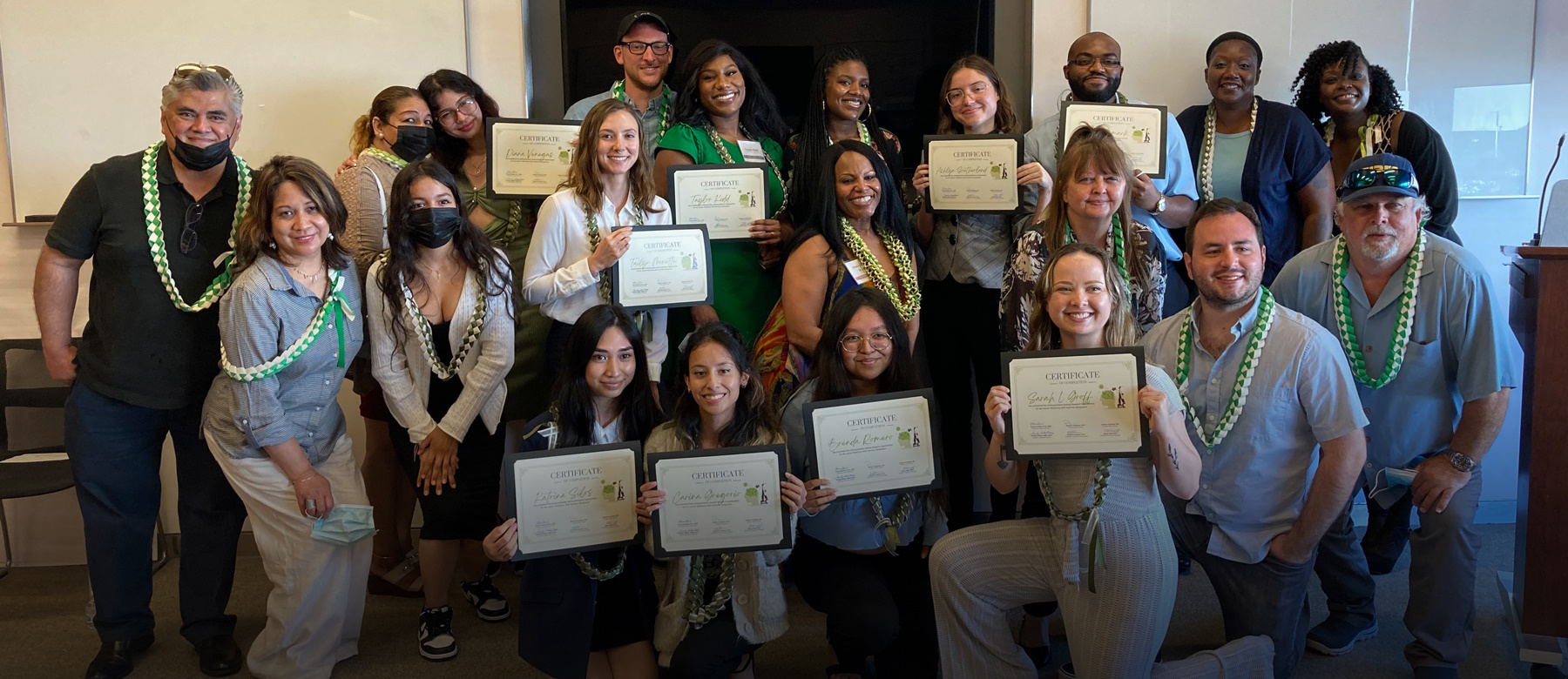 2022 U-GROW cohort with their families and certificates.