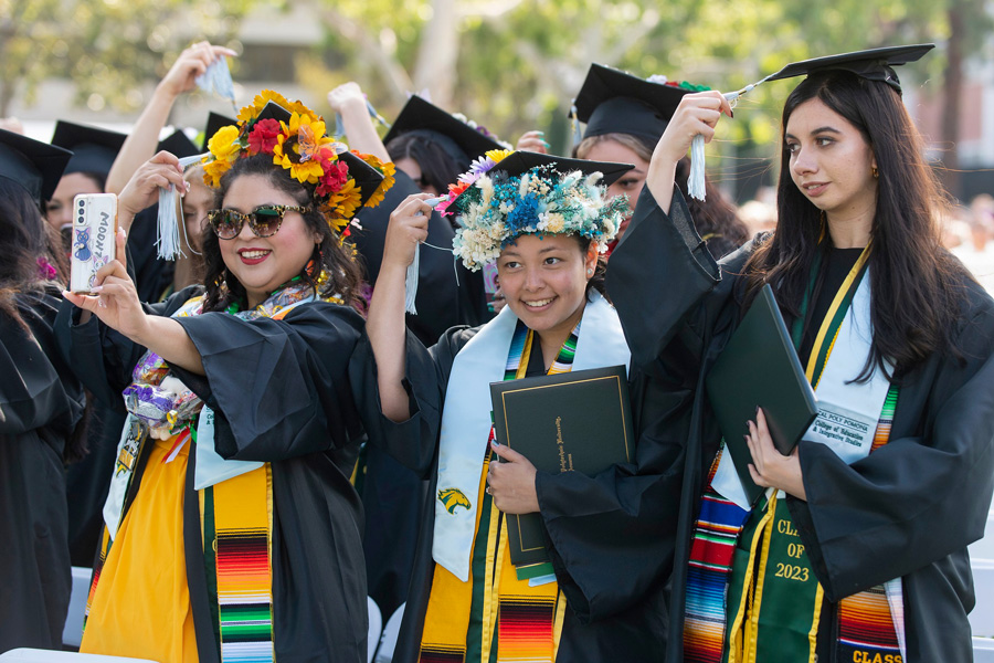 graduating students turn their tassels