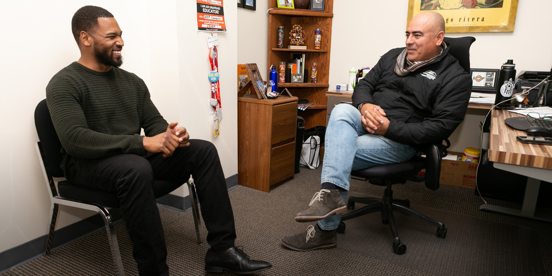 Louis sits with EOP retention counselor Francisco Checa.