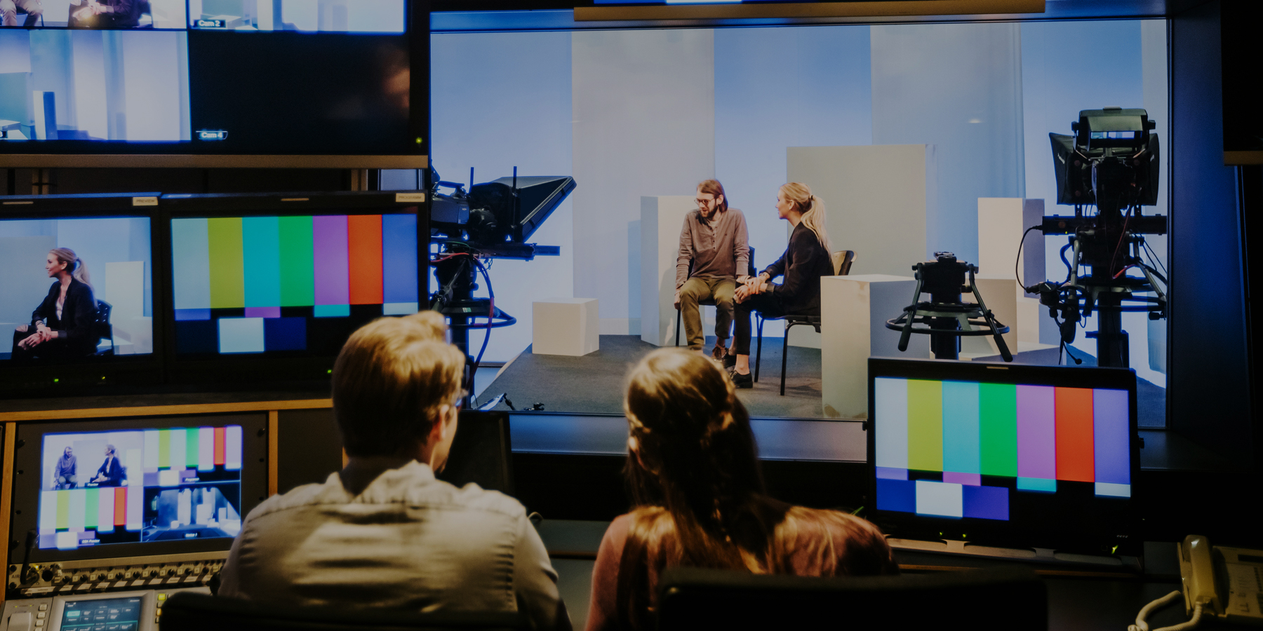 Students filming in a television studio
