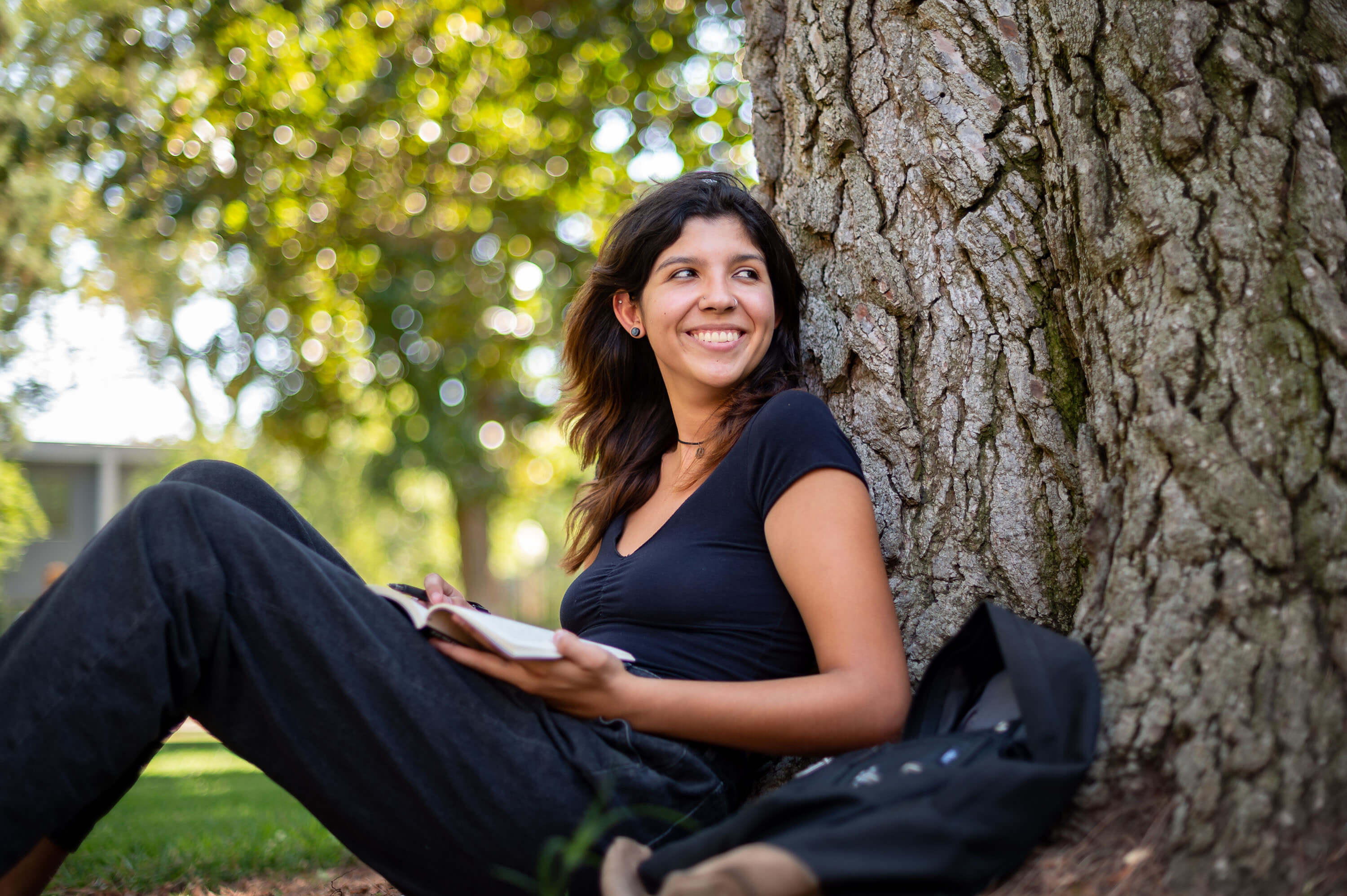 a college student studying on campus