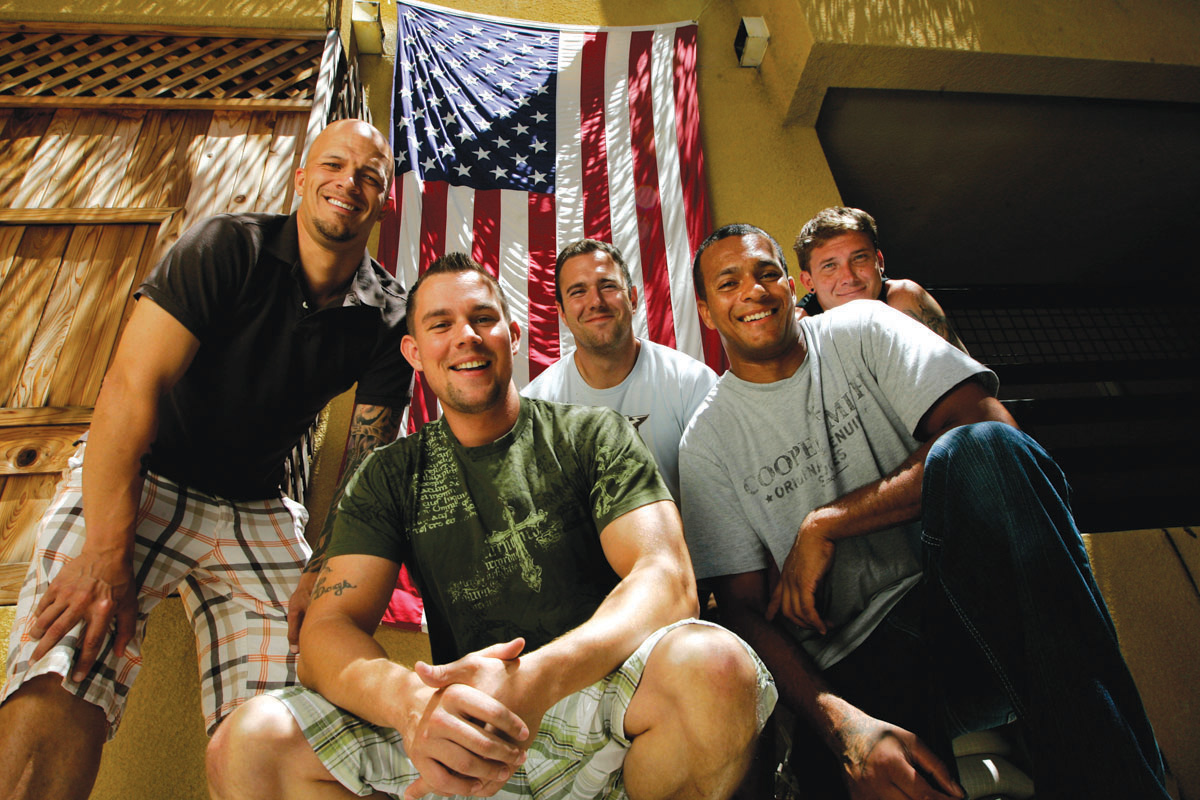 SDSU veterans pose with the United States flag on July 1, 2010.