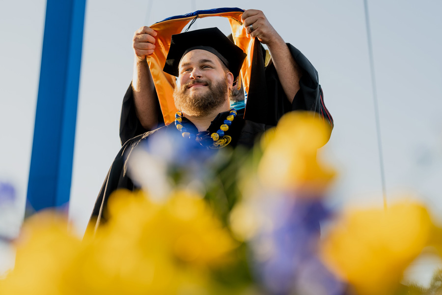 graduating masters student being hooded