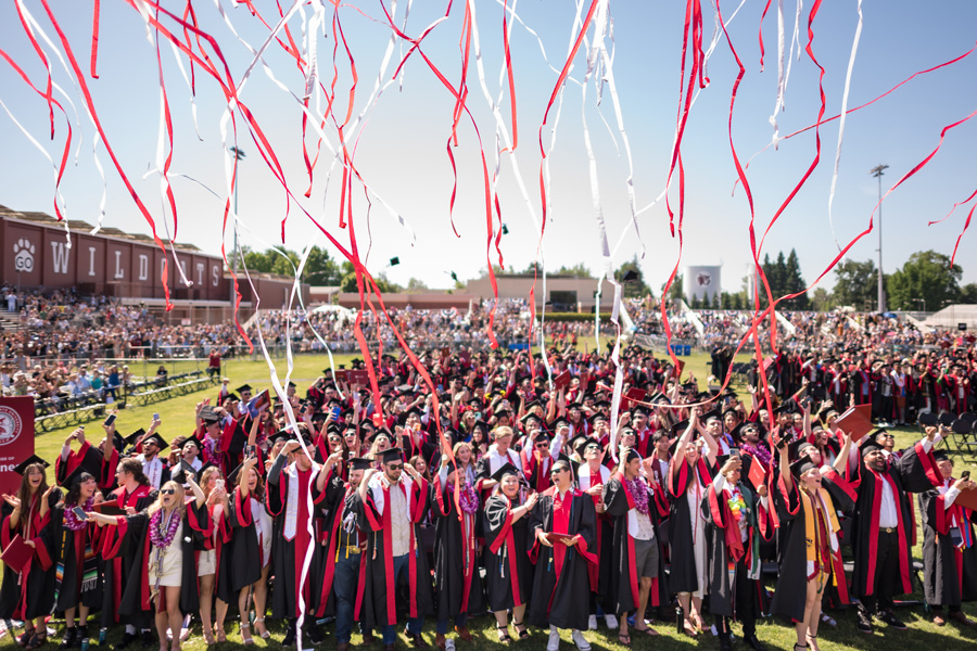 crowd of graduating students and streamers