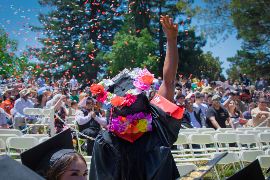 graduating student in flurry of confetti