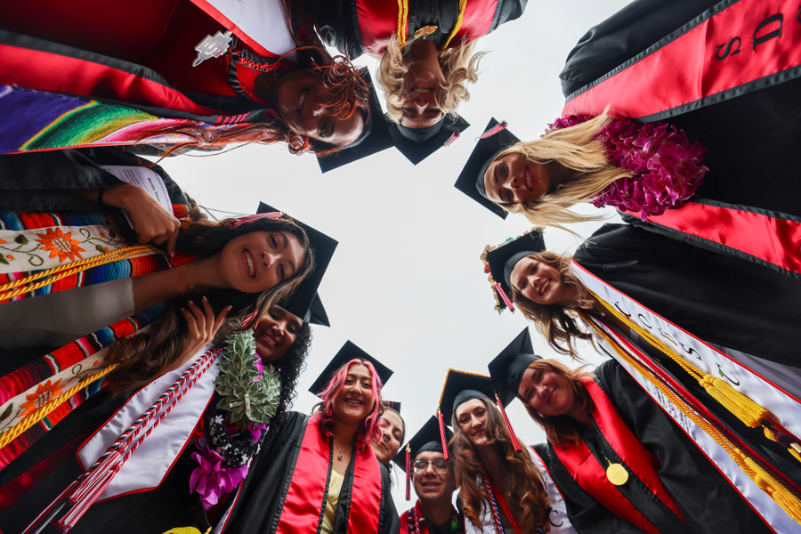 a group of smiling graduating students