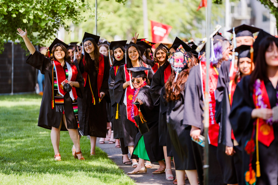 group of graduating students cheering