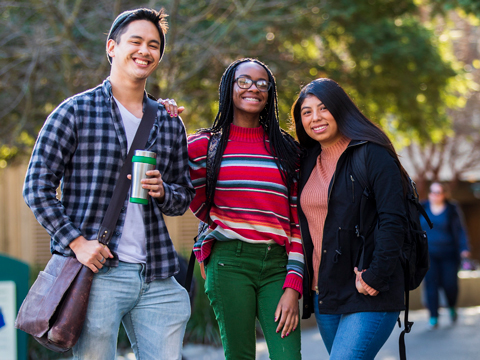 smiling college students, posing for a photo